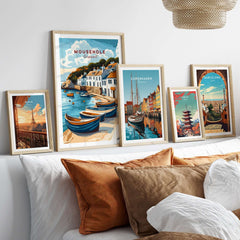 Mousehole Travel Print Cornwall framed alongside other travel posters in a coastal-inspired home decor setting.