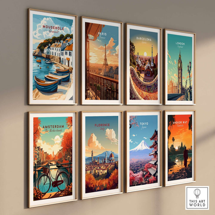 Gallery wall featuring framed travel prints of Mousehole, Paris, Barcelona, London, Amsterdam, Florence, Tokyo, and Angkor Wat