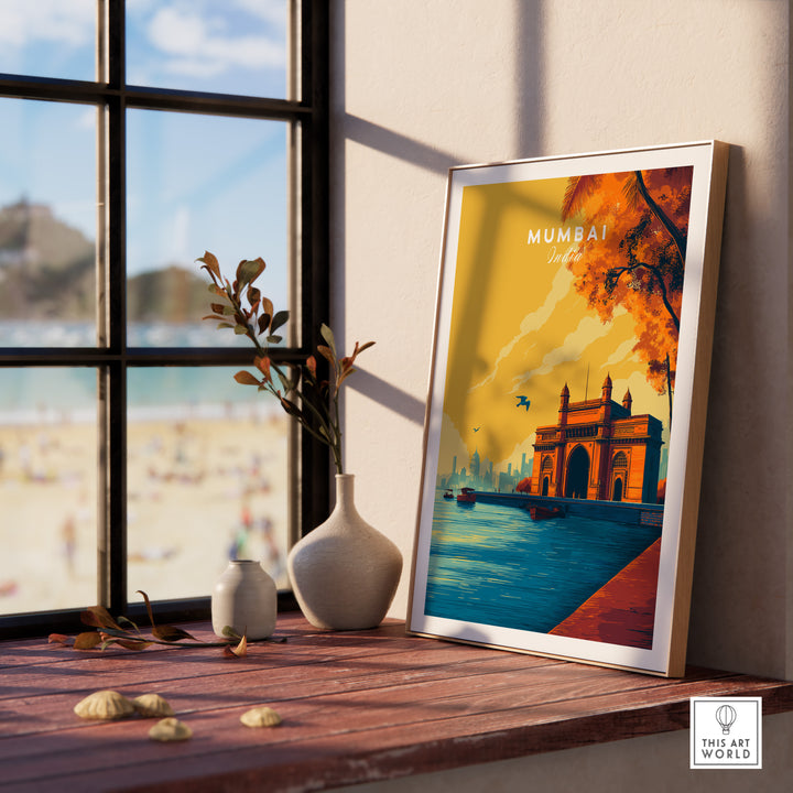 Gateway of India dusk poster on a table with a view of the beach, showcasing Mumbai's vibrant energy and cultural elegance.