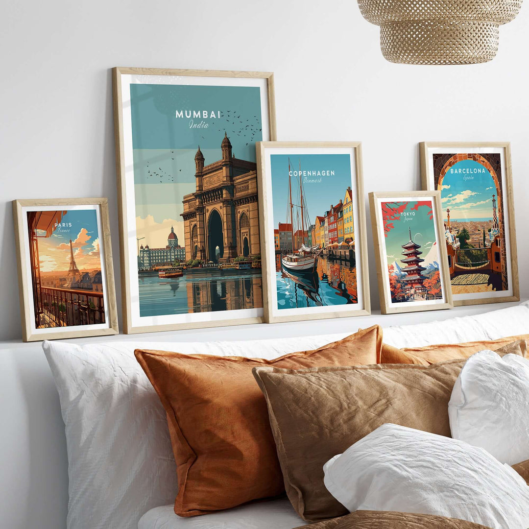 Mumbai Gateway of India print featured among framed travel posters on a stylish couch.