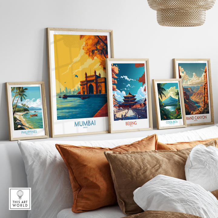 Framed wall art featuring famous monuments from Mumbai, Beijing, Costa Rica, and the Philippines, displayed in a cozy setting.