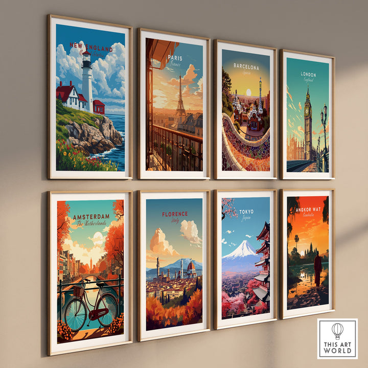 Wall display of travel art prints featuring New England lighthouse, Paris, Barcelona, London, Amsterdam, Florence, Tokyo, and Angkor Wat.