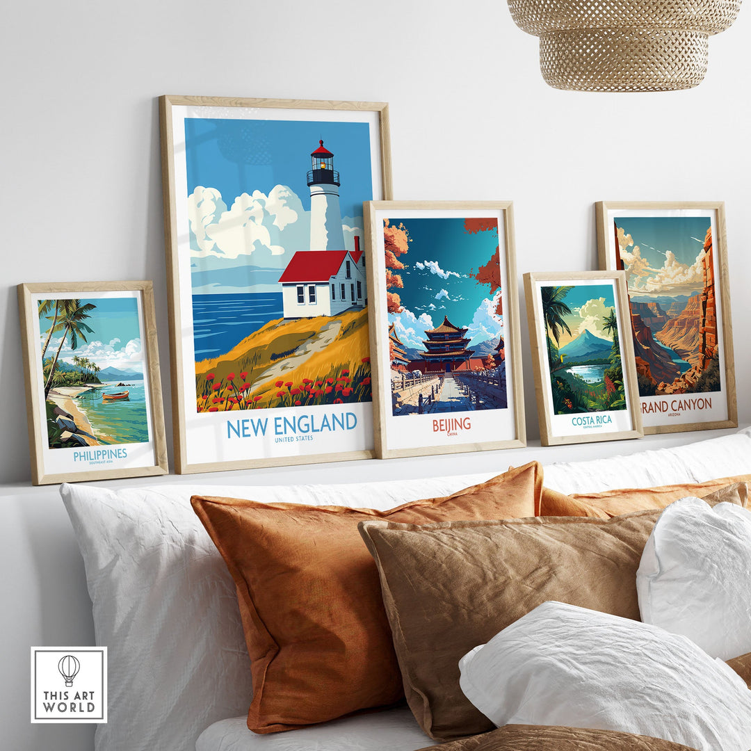 New England wall art print featuring a lighthouse displayed alongside travel posters for Philippines, Beijing, Costa Rica, and Grand Canyon.