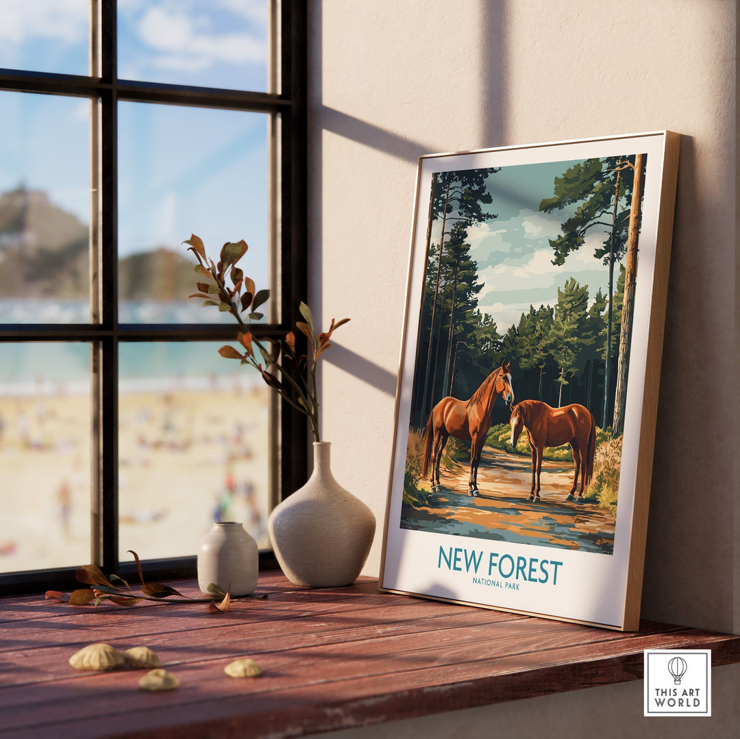 New Forest Print National Park poster with horses displayed on a windowsill overlooking a sunny beach.