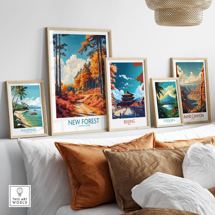 Gallery wall featuring New Forest England travel print and global city artworks above a cozy sofa.