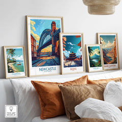 Newcastle Art Print featuring the Tyne Bridge, among other travel-themed art prints on a cozy couch.