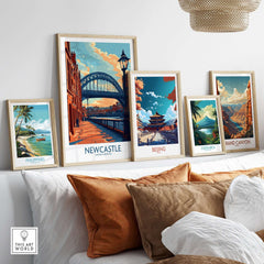Newcastle Poster featuring the iconic Tyne Bridge, displayed among other travel posters in a cozy interior.