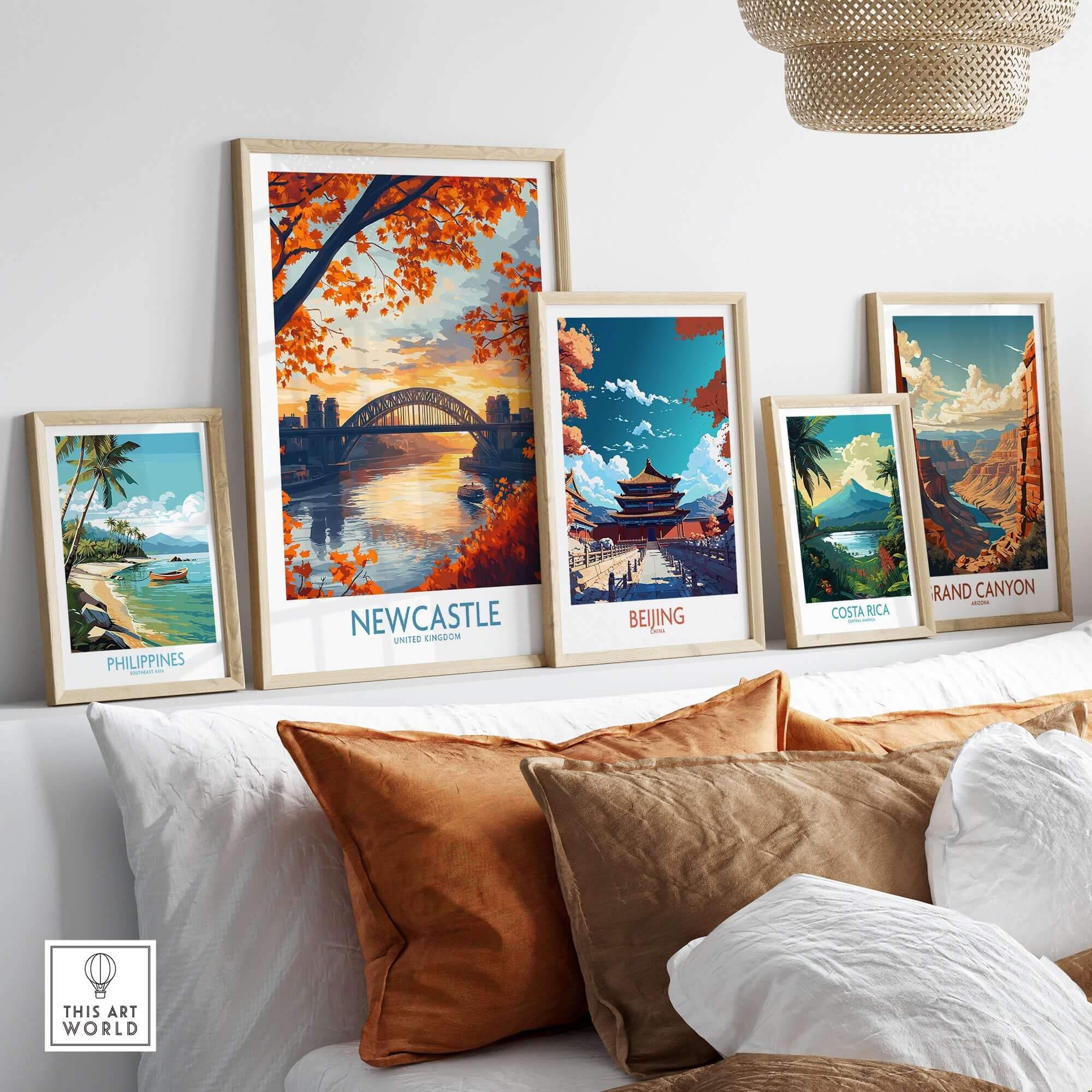 Newcastle Poster England displayed among framed travel posters on a stylish interior shelf.