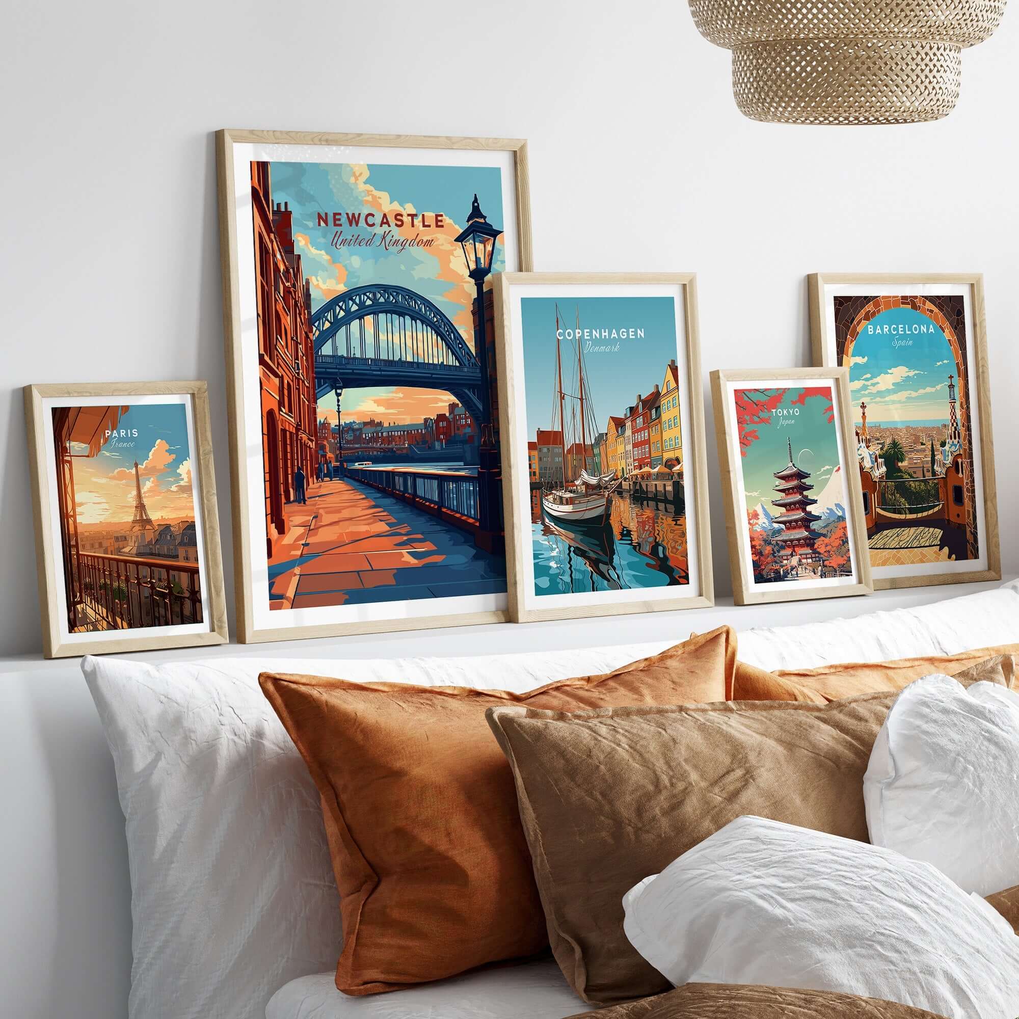 Newcastle Print featuring the iconic Tyne Bridge displayed among travel posters in a stylish home setting.