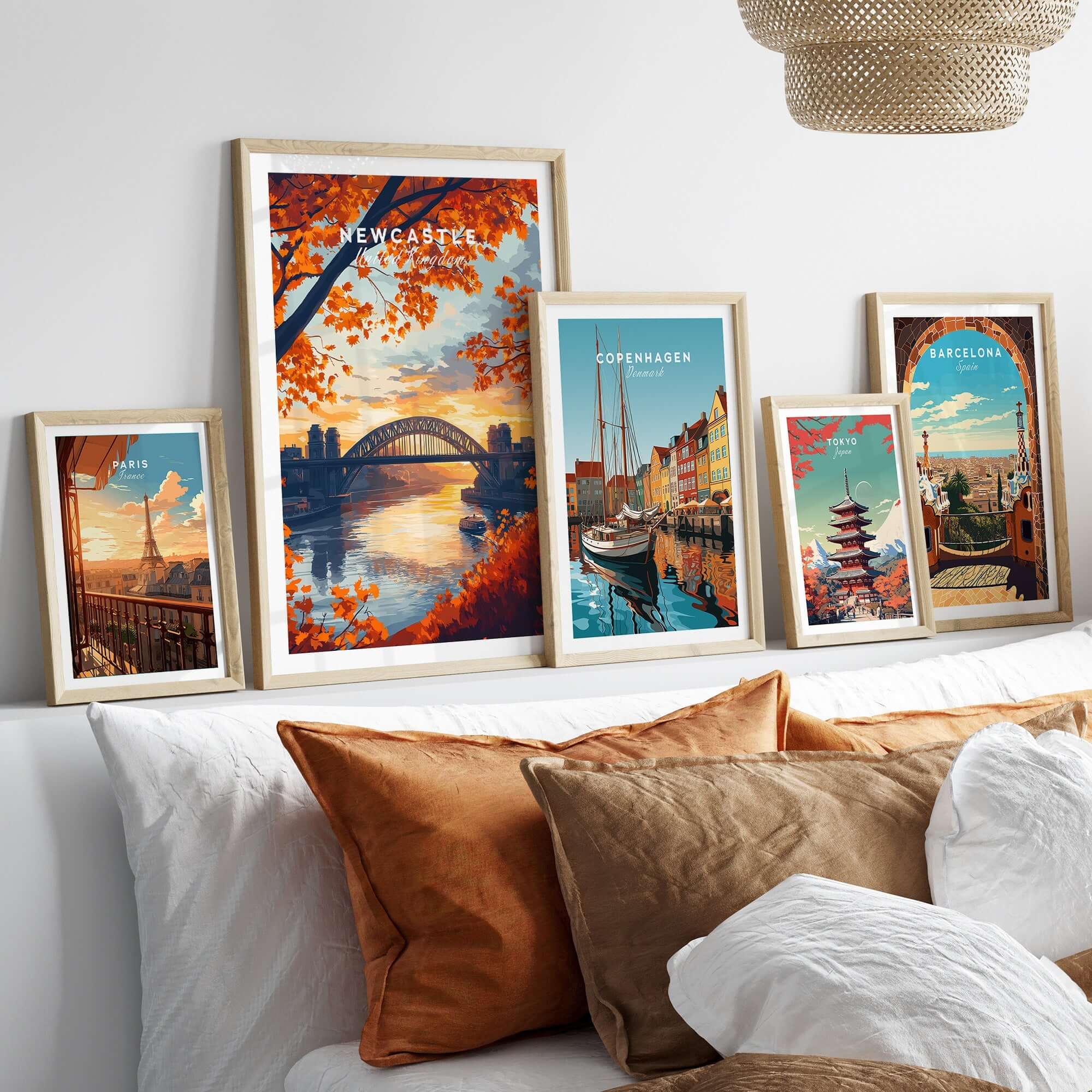 Newcastle Print England showcased with vibrant framed artworks on a stylish bedroom wall.