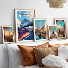 Newcastle Travel Print displayed among other city travel prints in a cozy interior setting.