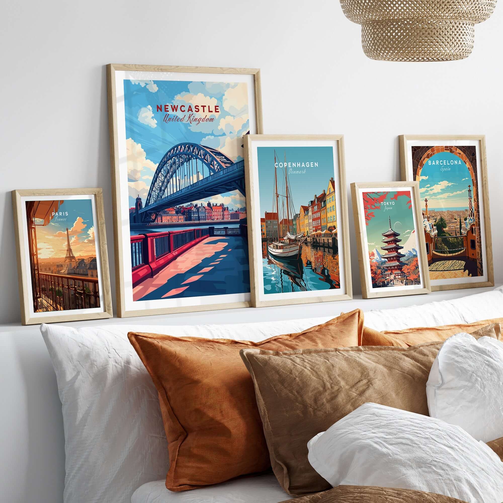 Newcastle Travel Print displayed among other city travel prints in a cozy interior setting.