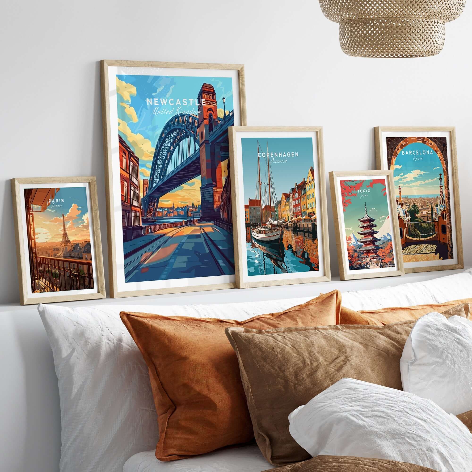 Newcastle Wall Art Poster displayed among other travel art prints, showcasing the Tyne Bridge in a stylish interior setting.