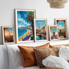 Nice Wall Art - French Riviera travel posters displayed in stylish frames on a cozy bed.