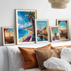 Nice Wall Art Print - France displayed among travel posters of Copenhagen and Barcelona on a stylish white shelf.
