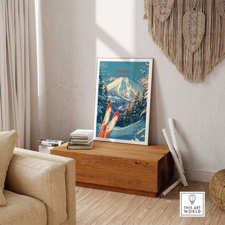 Framed Niseko print of Japanese ski landscape on wooden bench in cozy living room with books and wall decor.