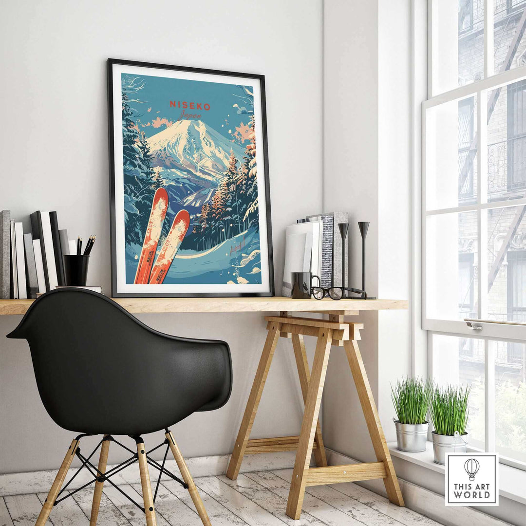 Stylish room with framed Niseko print art of Japan, featuring snowy mountains and skis, on a minimalist desk setup.