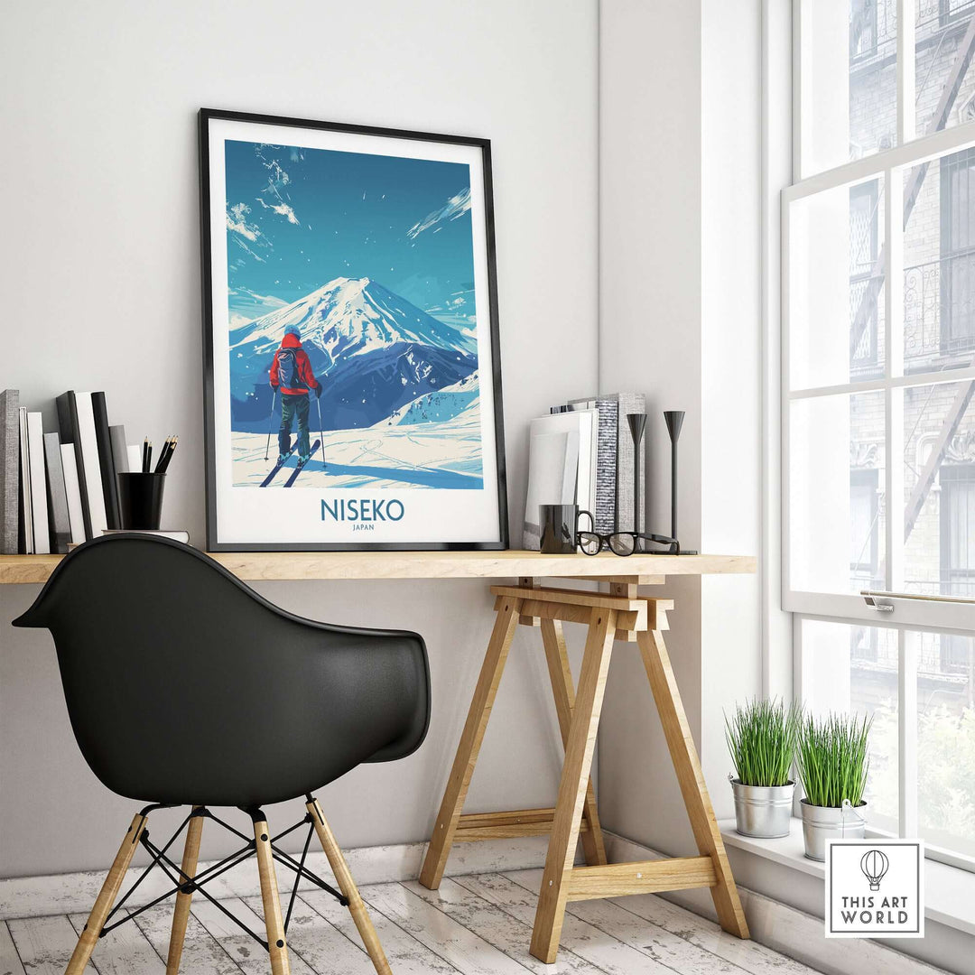 Modern room featuring a Niseko ski poster of a snowy mountain scene in Japan, displayed on a wooden desk next to a black chair.