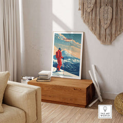 Niseko travel poster showcasing skier against snowy mountains in a stylish living room setting.