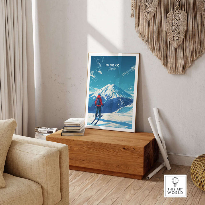 Niseko Travel Print featuring a skier with a view of a snowy mountain, displayed in a cozy living room setting.