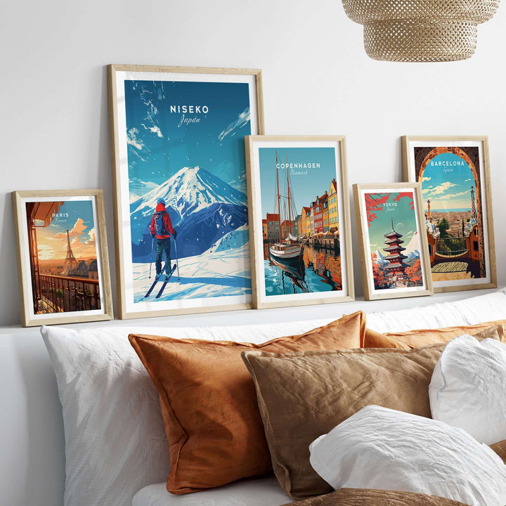 Gallery of framed travel prints featuring Niseko, Japan, and other global destinations on a cozy living room shelf.