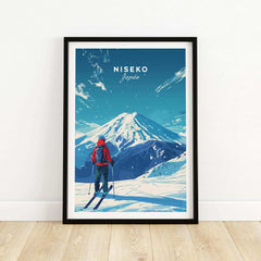 Framed Niseko travel print depicting a skier viewing snow-covered mountains in Japan.