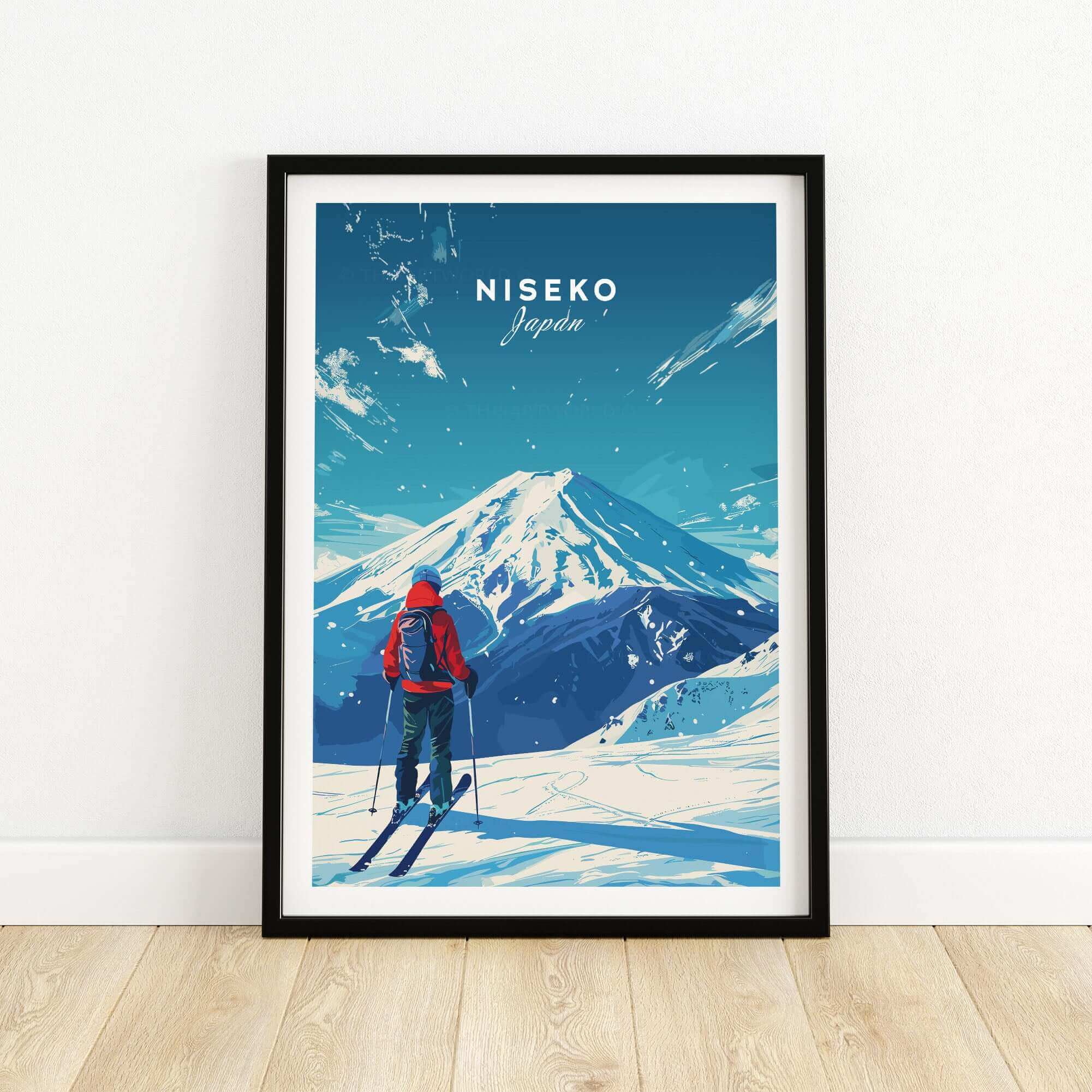 Framed Niseko travel print depicting a skier viewing snow-covered mountains in Japan.
