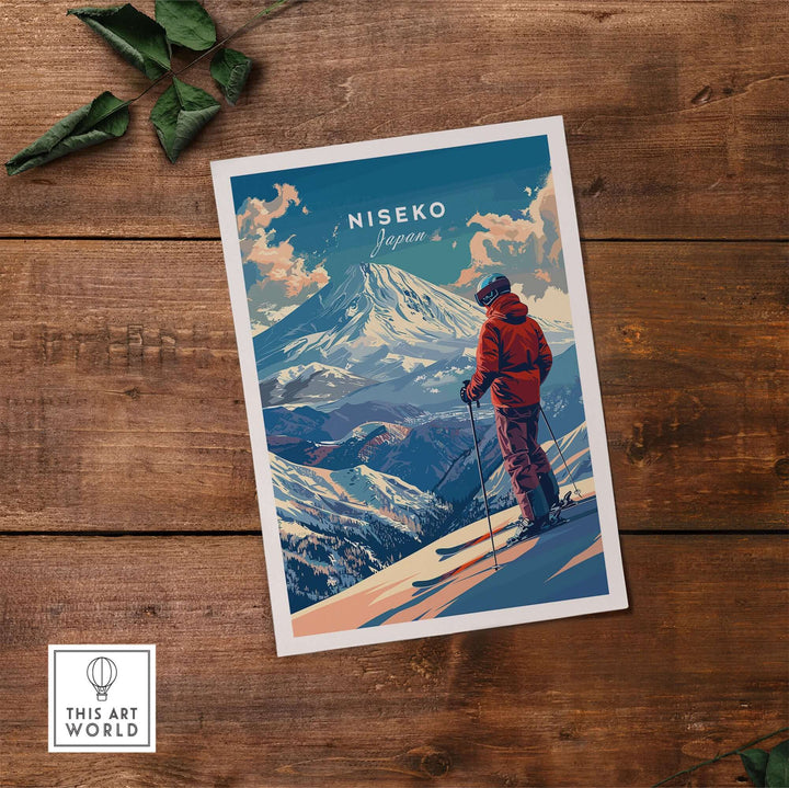 Niseko Japan wall art featuring a skier on a snowy mountain, displayed on a rustic wooden table with green leaves.