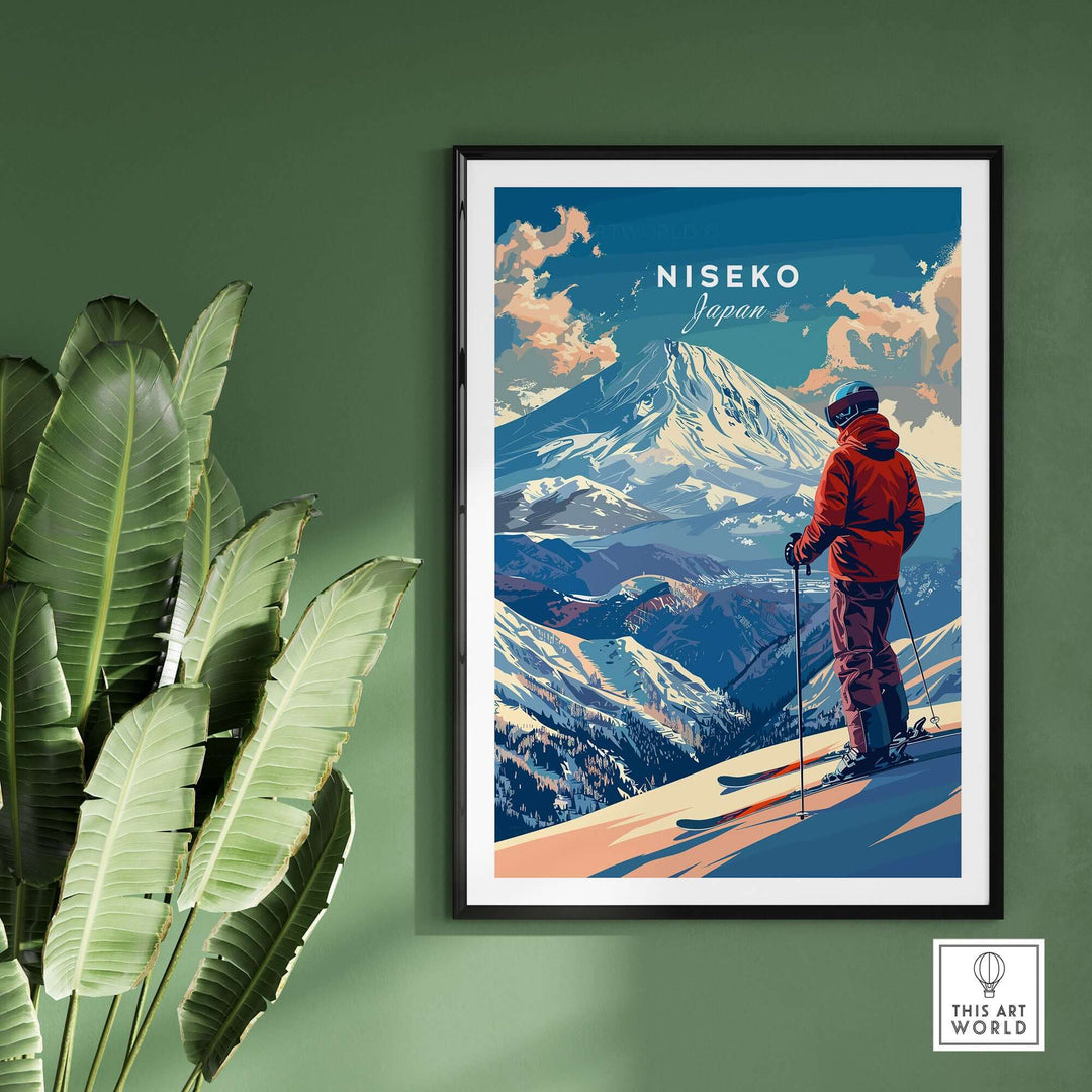 Scenic Niseko Japan wall art featuring a skier overlooking snow-covered mountains, framed on a green wall with plants.