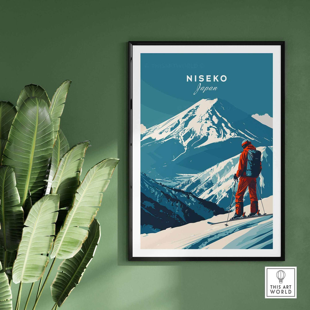 Niseko wall art poster featuring a skier on a snowy mountain in Japan, framed against a green wall with tropical plants.