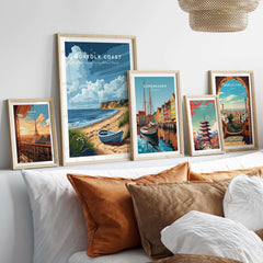 Norfolk Coast Art Print featuring coastal landscapes, displayed with other travel art prints in stylish frames.