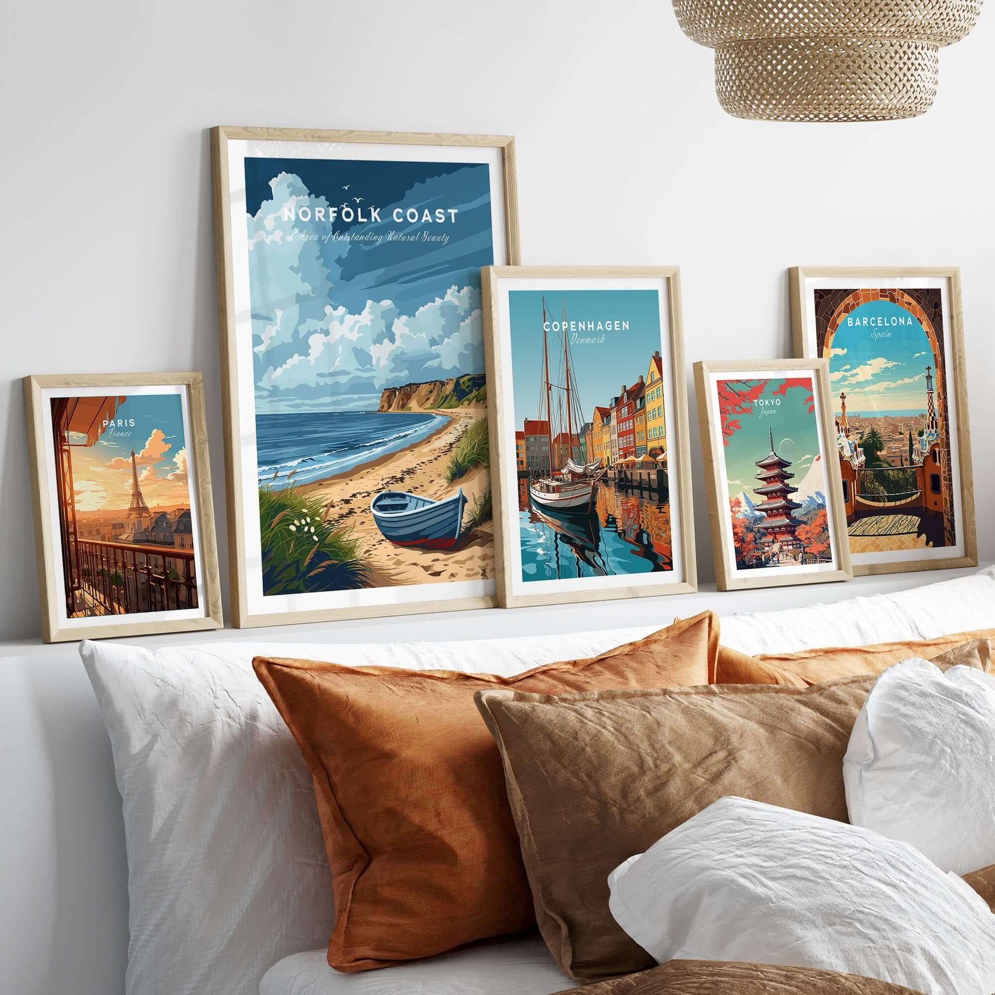 Norfolk Coast Art Print featuring coastal landscapes, displayed with other travel art prints in stylish frames.