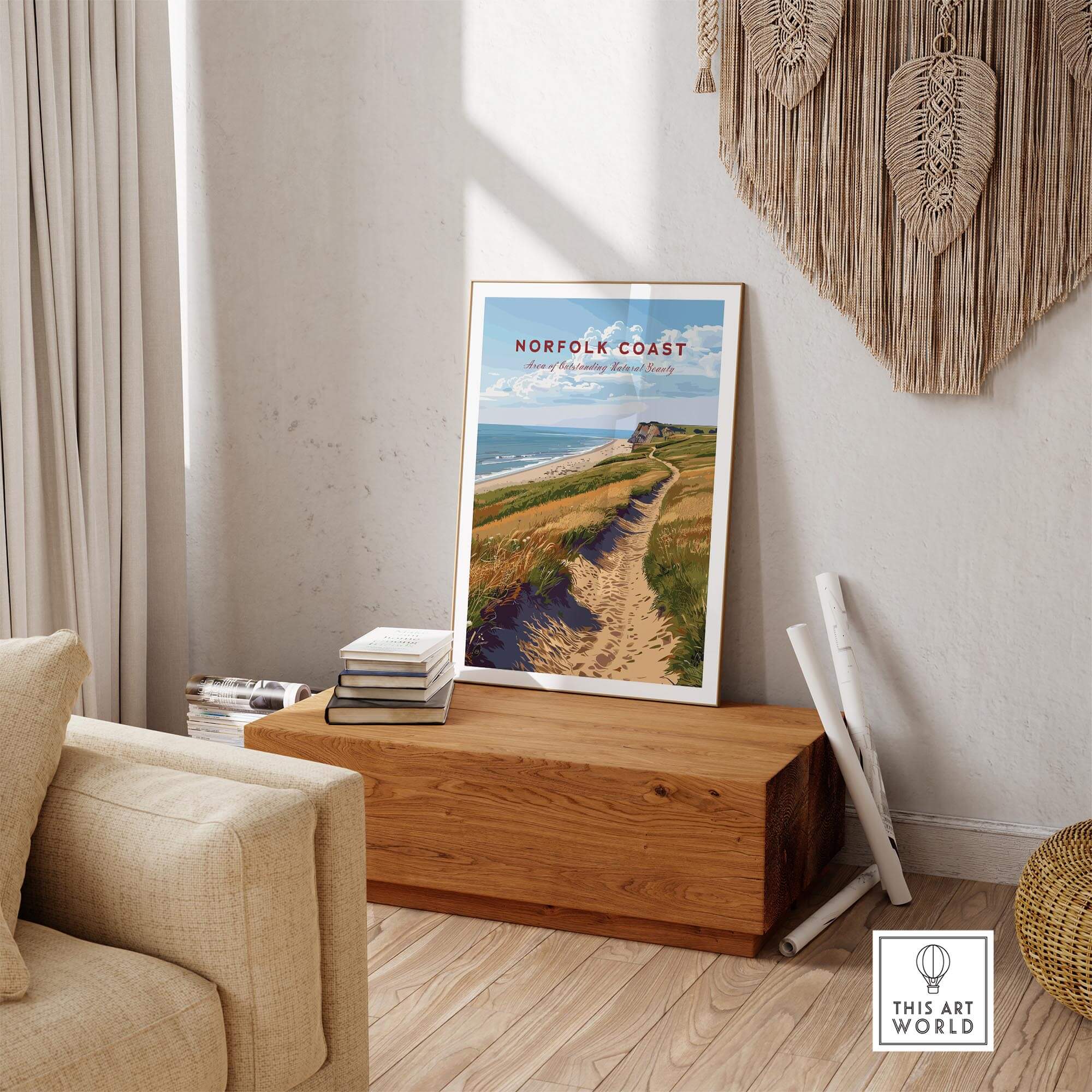 Norfolk Coast Poster displayed in a cozy living room, featuring the serene landscape of the Norfolk coastline.