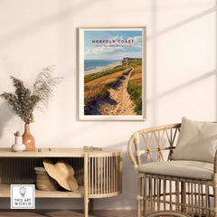 Norfolk Coast Poster framed on a wall, showcasing the scenic beauty of the Norfolk coast with a winding path.