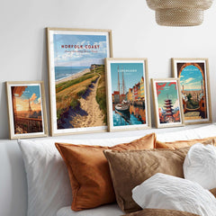 Norfolk Coast Poster showcased among other travel art prints in a stylish home decor setting.
