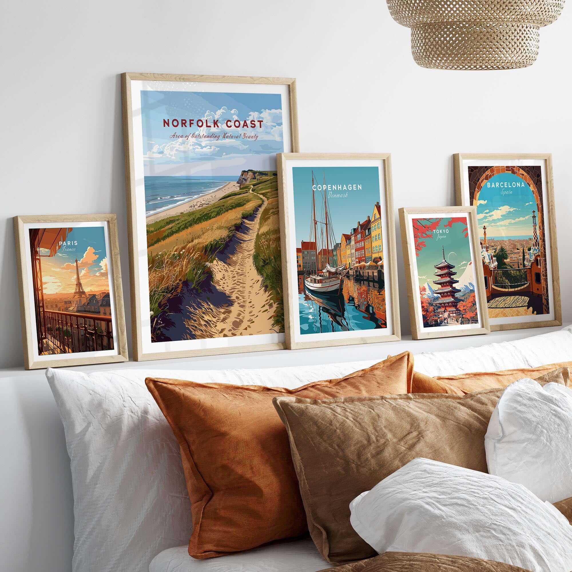 Norfolk Coast Poster showcased among other travel art prints in a stylish home decor setting.