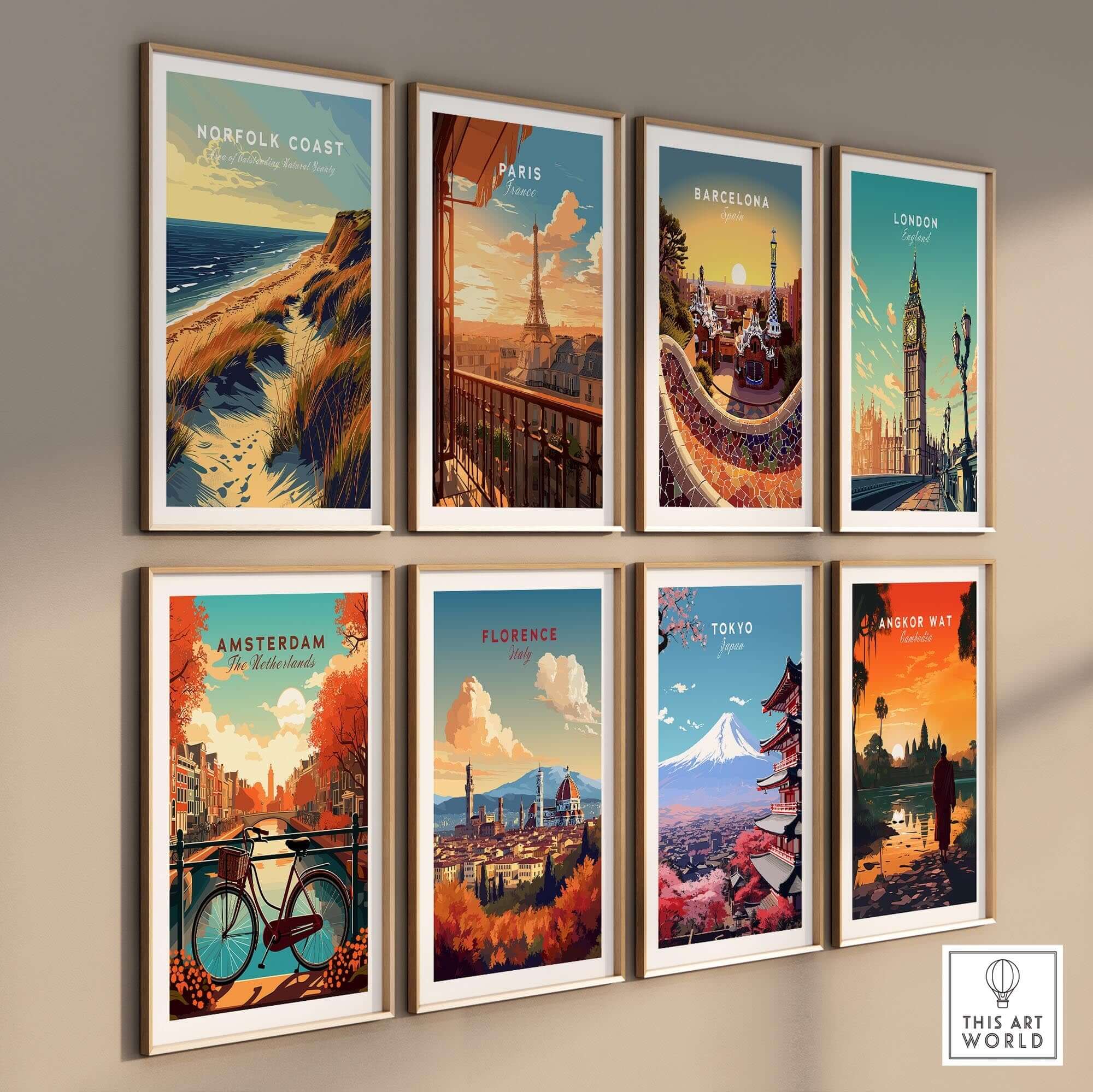 Norfolk Coast Poster Print and other travel posters framed on a wall, showcasing iconic destinations.