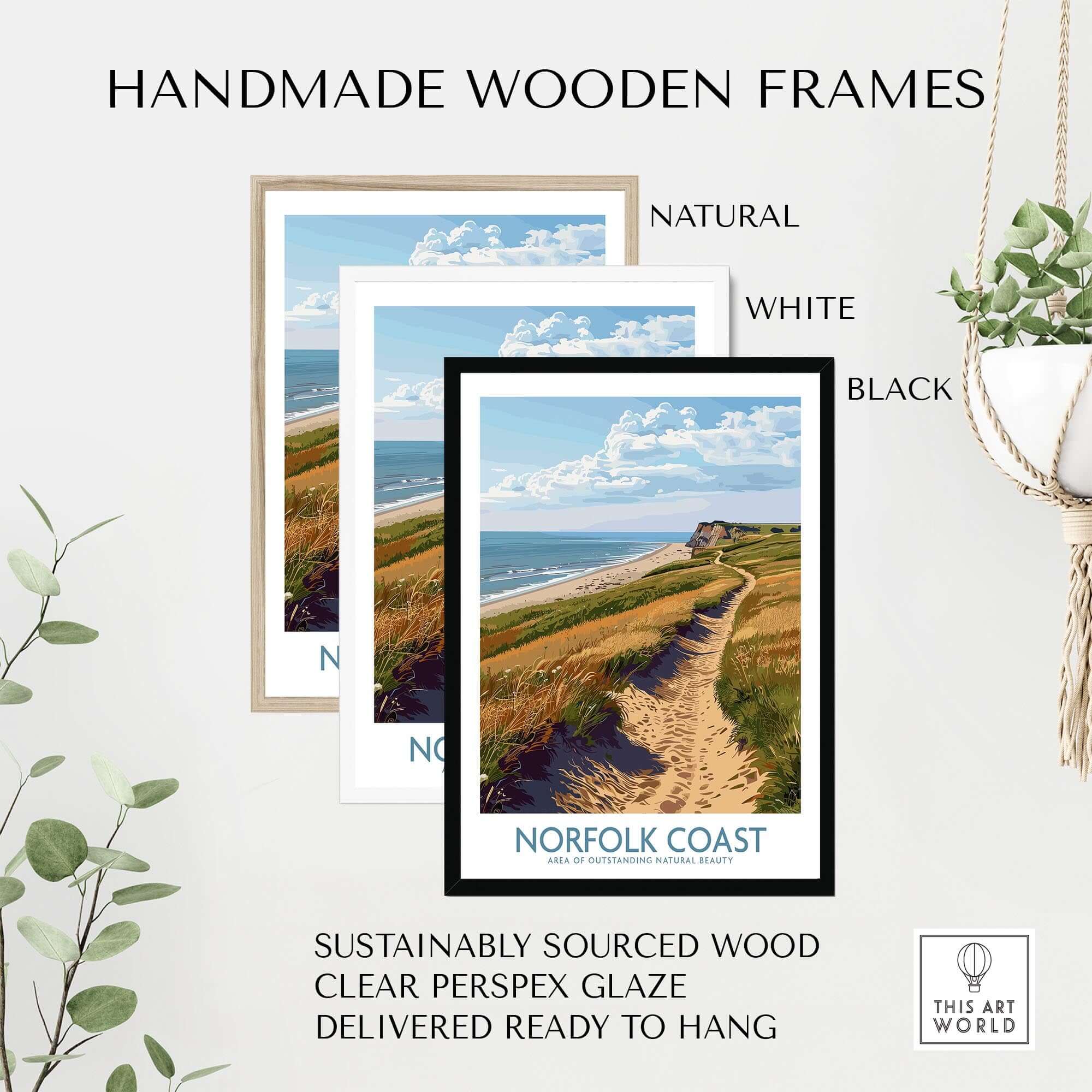 Handmade wooden frames featuring the Norfolk Coast Print in natural, white, and black finishes for a coastal decor accent.
