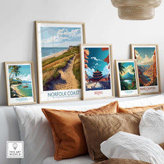 Norfolk Coast Travel Print displayed among other travel prints in a stylish home setting.