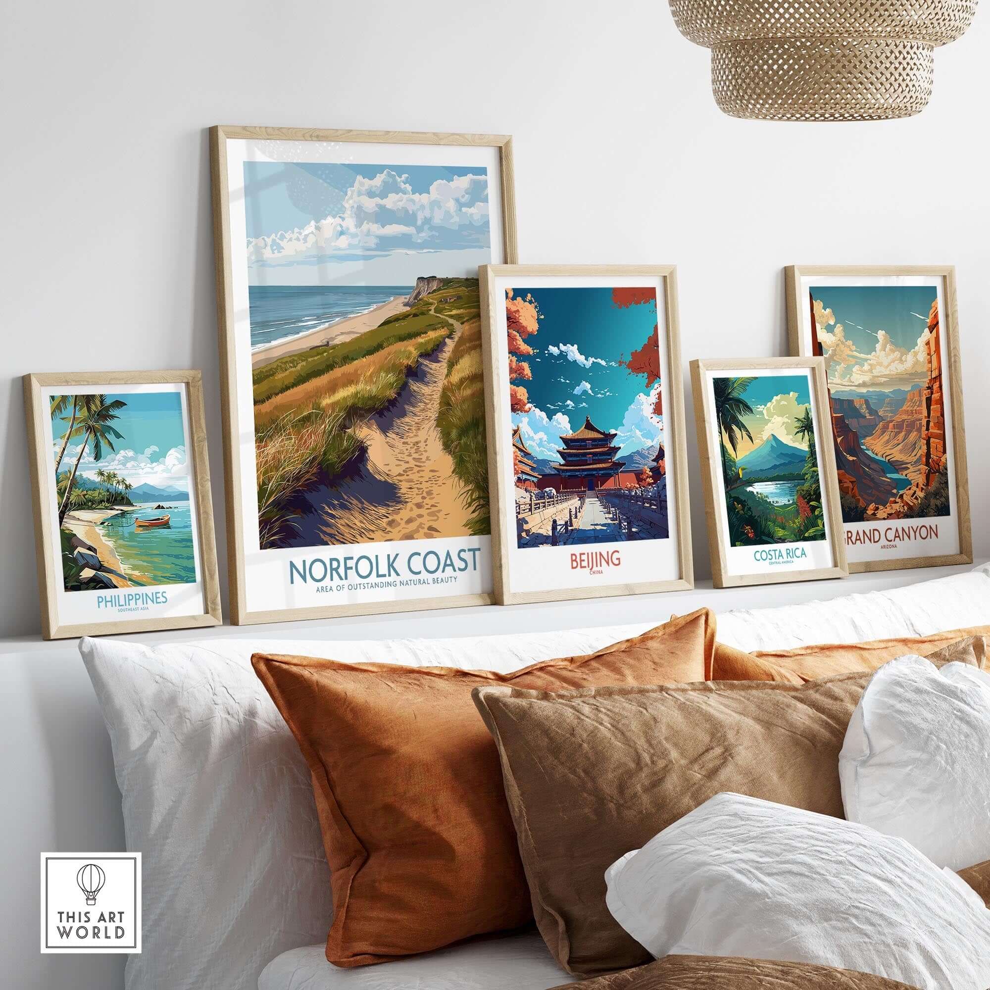 Norfolk Coast Travel Print displayed among other travel prints in a stylish home setting.