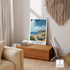 Norfolk Coast Wall Art print featuring serene beach and boat decor in a stylish living room setting.