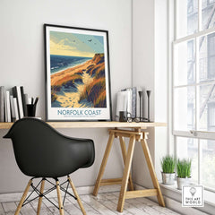 Norfolk Coast Wall Art Print showcased in a stylish workspace with a modern chair and natural light.