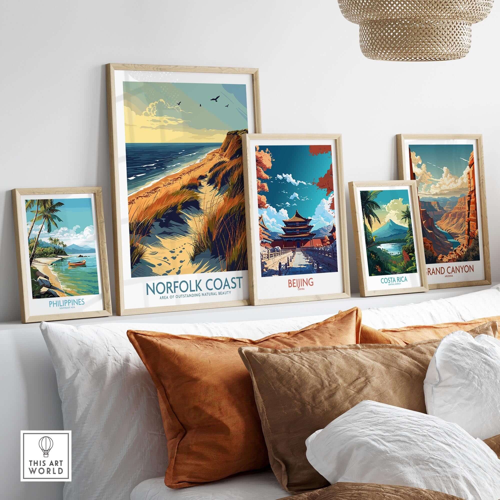 Norfolk Coast Wall Art Print among various travel destination artworks in a home decor setting.