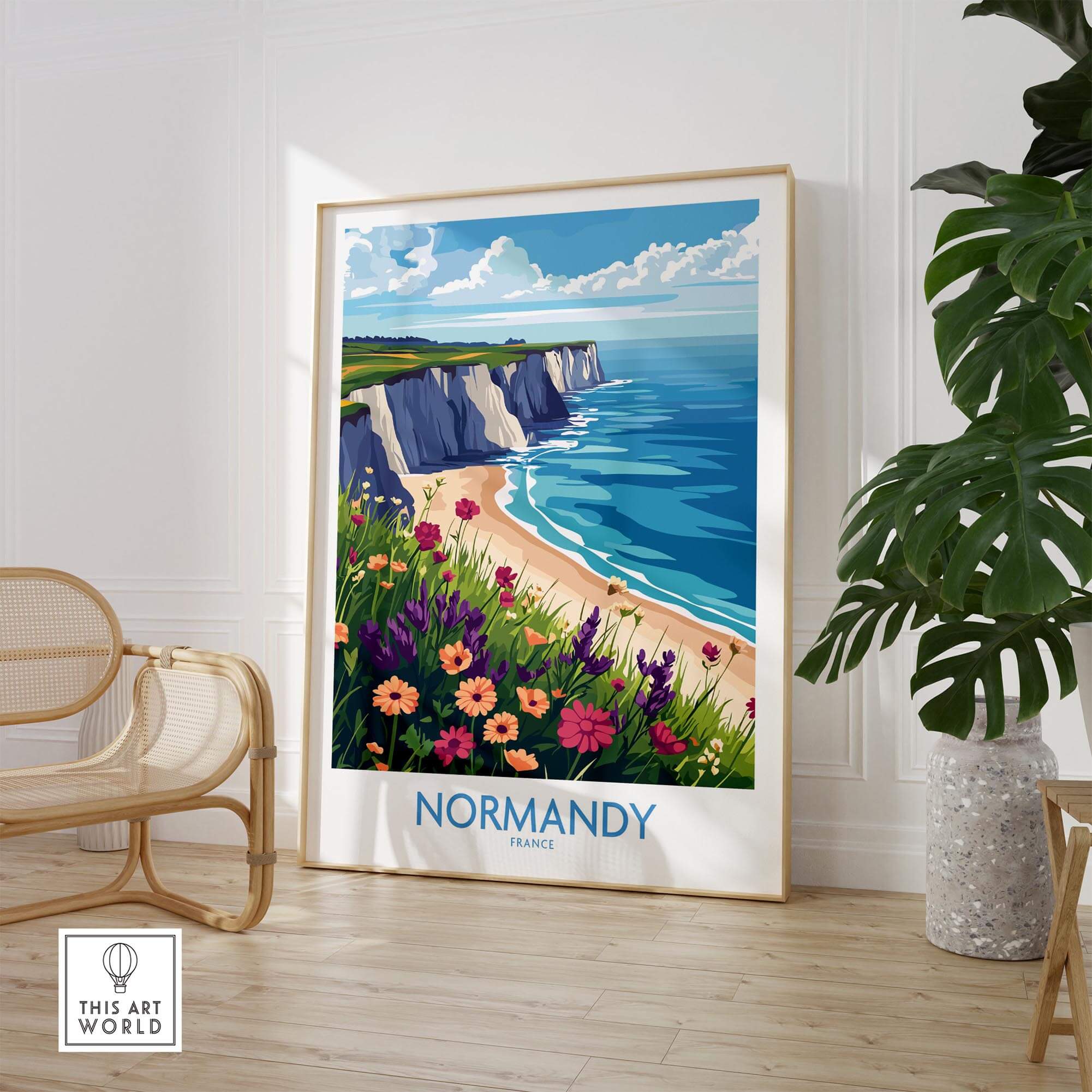 Normandy Travel Poster showcasing picturesque coast and vibrant flowers in a stylish interior setting.