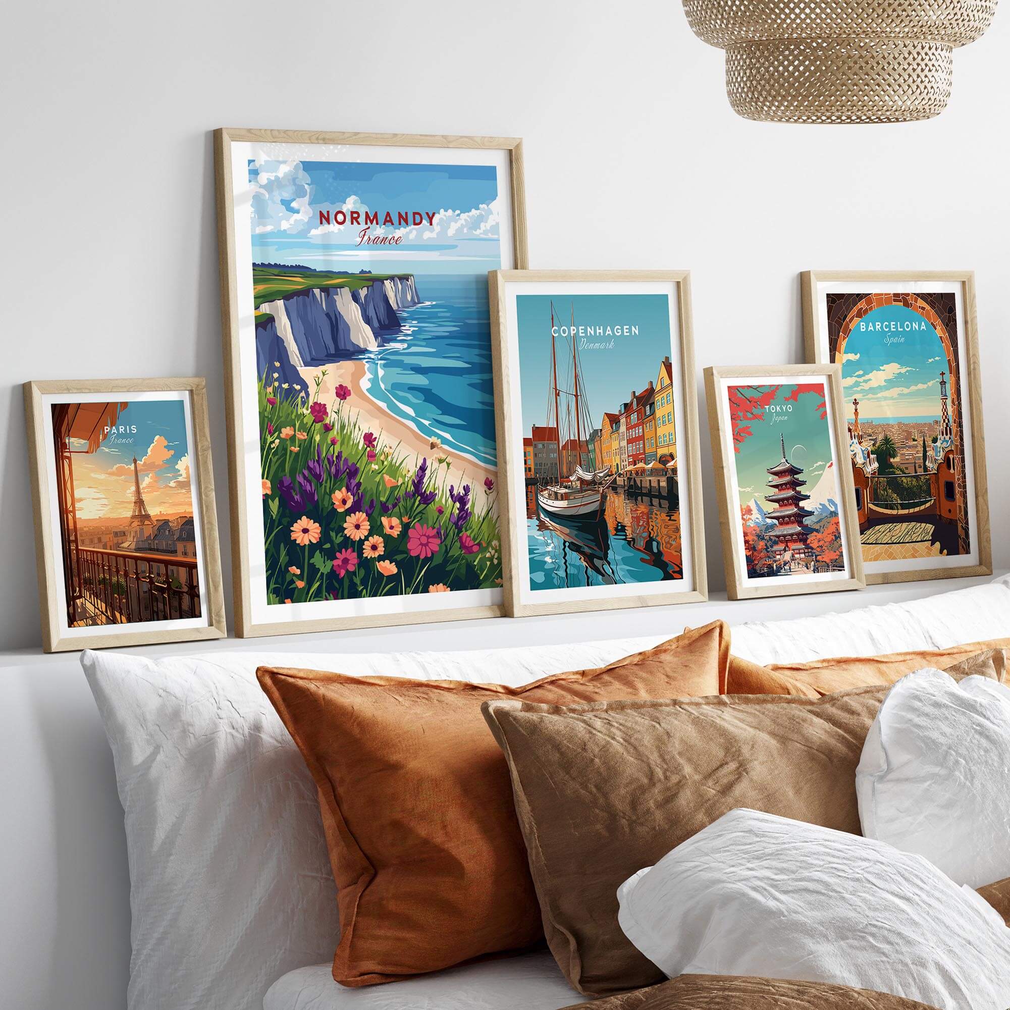 Normandy Travel Print showcased among other travel prints on a stylish wall in a cozy living space.