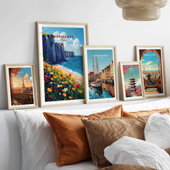 Normandy Wall Art Print and other travel posters displayed in a stylish home decor setting.