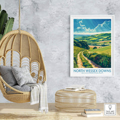 North Wessex Downs Art Print displayed in a stylish living room setting with wicker furniture.