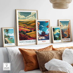 North Wessex Downs Travel Print displayed among other travel prints on a cozy couch setting.