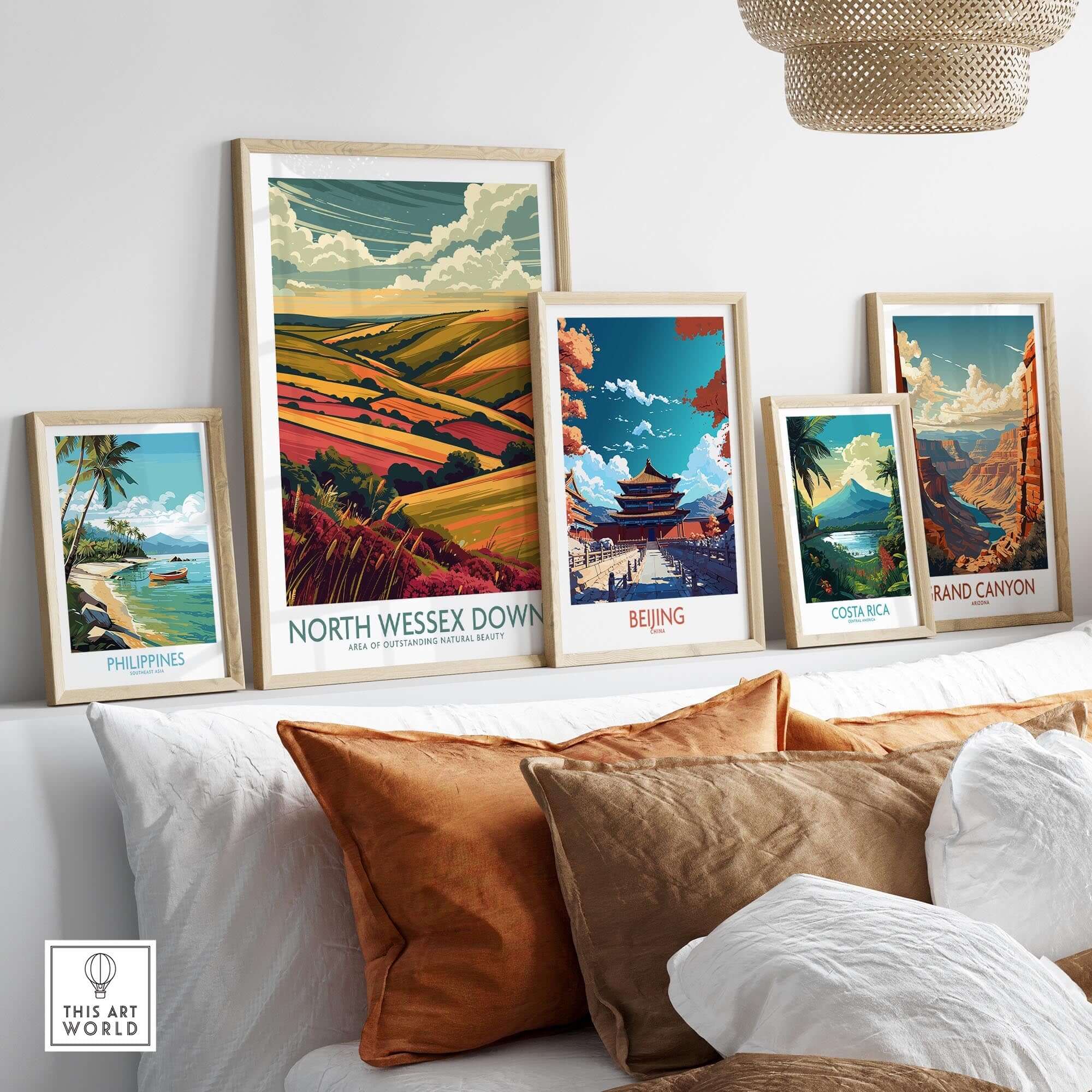 North Wessex Downs Travel Print displayed among other travel prints on a cozy couch setting.