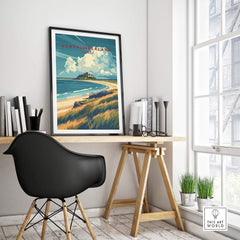 Northumberland Coast Travel Print featuring Bamburgh Castle in a coastal landscape by a desk.